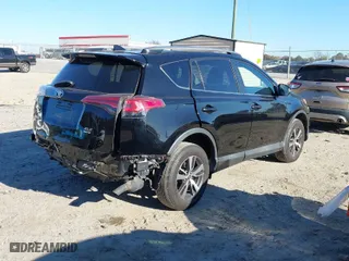 2018 Toyota RAV4 XLE with VIN 2T3RFREV9JW793956, listed as a IAAI auction lot 41012152 with 77,033 mi miles. Bid and sale history available at carsss.com. Image 4.
