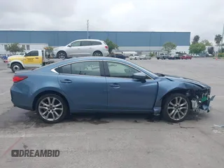 2014 Mazda 6 i Grand Touring with VIN JM1GJ1W64E1133729, listed as a IAAI auction lot 42050222 with 112,464 mi miles and . Bid and sale history available at DreamBid. Image 13.