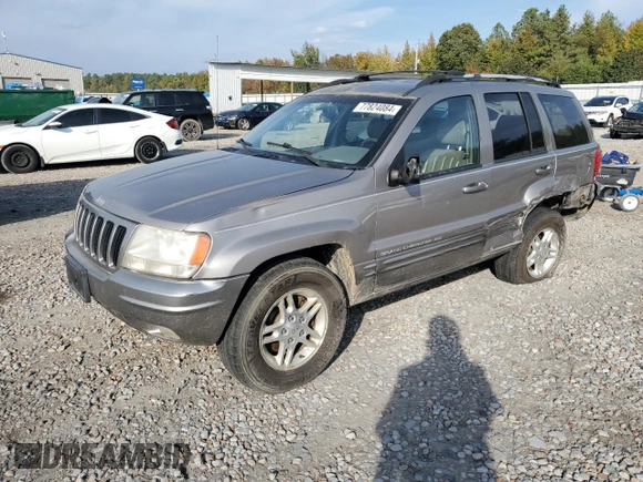 1999 Jeep Grand Cherokee Limited with VIN 1J4G268S7XC668348, listed as a Copart auction lot 77824084 with 165,779 mi miles and Salvage title. Bid and sale history available at DreamBid. Image 1.