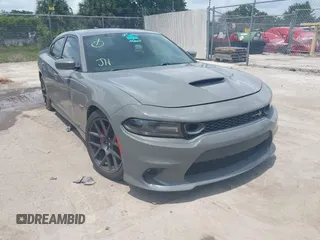 2019 Dodge Charger Scat Pack with VIN 2C3CDXGJ2KH633854, listed as a IAAI auction lot 42212517 with 74,285 mi miles and . Bid and sale history available at DreamBid. Image 1.