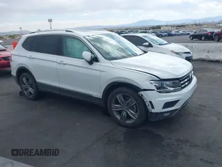 2021 Volkswagen Tiguan SE z VIN 3VV3B7AX9MM025009, wystawiony jako IAAI lot #42085353 z przebiegiem 63 946 mil mil oraz . Historia ofert i sprzedaży dostępna na DreamBid. Obrazek 1.