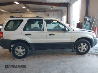 2003 Ford Escape XLS Popular with VIN 1FMYU02123KD48951, listed as a IAAI auction lot 41765772 with 208,796 mi miles. Bid and sale history available at carsss.com. Image 13.