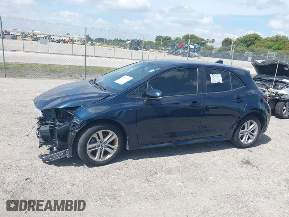 2019 Toyota Corolla Hatchback SE with VIN JTNK4RBE3K3061589, listed as a IAAI auction lot 42123273 with 90,491 mi miles. Bid and sale history available at carsss.com. Image 14.