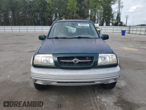 1999 Suzuki Grand Vitara JLX z VIN JS3TD62V0X4124366, wystawiony jako Copart lot #50885055 z przebiegiem 204 168 mil mil oraz Szkoda całkowita • Salvage title. Historia ofert i sprzedaży dostępna na DreamBid. Obrazek 5.