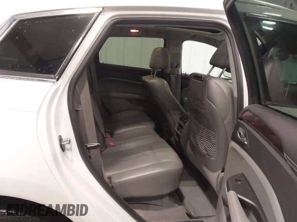 2012 Cadillac SRX Premium Collection z VIN 3GYFNFE38CS591123, wystawiony jako IAAI lot #41827636 z przebiegiem 143 867 mil mil oraz . Historia ofert i sprzedaży dostępna na DreamBid. Obrazek 8.