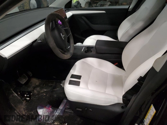 2024 Tesla Model Y Long Range with VIN 7SAYGDEE5RA237687, listed as a Copart auction lot 48366825 with 24,650 mi miles and Salvage Title. Bid and sale history available at DreamBid. Image 7.