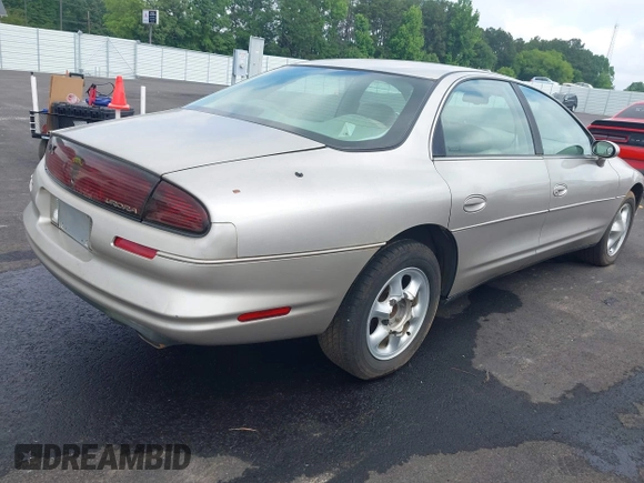 1997 Oldsmobile Aurora z VIN 1G3GR62CXV4121200, wystawiony jako IAAI lot #42277003 z przebiegiem 198 048 mil mil oraz . Historia ofert i sprzedaży dostępna na DreamBid. Obrazek 4.