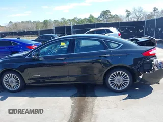 2013 Ford Fusion Titanium Hybrid with VIN 3FA6P0RU2DR288773, listed as a IAAI auction lot 41803708 with 85,868 mi miles and . Bid and sale history available at DreamBid. Image 14.