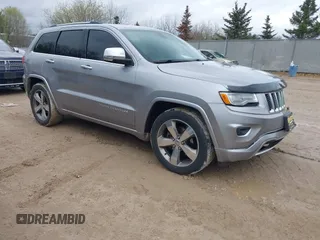 2015 Jeep Grand Cherokee Overland z VIN 1C4RJFCG1FC104102, wystawiony jako IAAI lot #42160396 z przebiegiem 175 609 mil mil oraz . Historia ofert i sprzedaży dostępna na DreamBid. Obrazek 1.