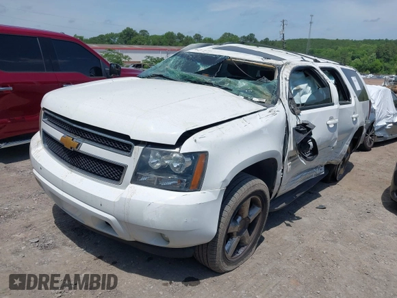 2013 Chevrolet Tahoe LT with VIN 1GNSCBE07DR372979, listed as a IAAI auction lot 42281955 with 214,737 mi miles and . Bid and sale history available at DreamBid. Image 2.