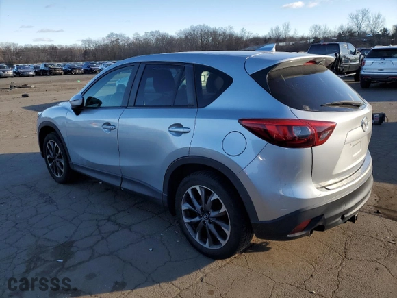 2016 Mazda CX-5 Grand Touring with VIN JM3KE4DYXG0713698, listed as a Copart auction lot 87176794 with 114,435 mi miles and Salvage Title. Bid and sale history available at carsss.com. Image 2.