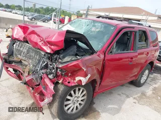 2010 Mercury Mariner Premier with VIN 4M2CN9H77AKJ24786, listed as a IAAI auction lot 42681920 with 230,785 mi miles and . Bid and sale history available at DreamBid. Image 2.
