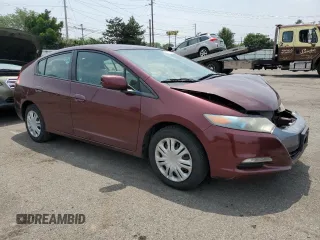 2011 Honda Insight with VIN JHMZE2H31BS008097, listed as a Copart auction lot 60780625 with 111,688 mi miles and Salvage title. Bid and sale history available at DreamBid. Image 4.