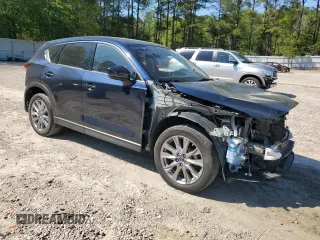 2019 Mazda CX-5 Grand Touring with VIN JM3KFBDMXK0540725, listed as a Copart auction lot 52395185 with 33,838 mi miles and Salvage Title. Bid and sale history available at carsss.com. Image 4.
