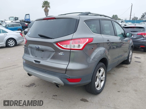 2014 Ford Escape SE with VIN 1FMCU9GX7EUC04296, listed as a IAAI auction lot 42159486 with 108,598 mi miles and . Bid and sale history available at DreamBid. Image 4.