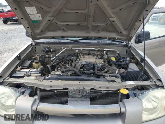 2004 Nissan Frontier XE with VIN 1N6ED29X64C478172, listed as a Copart auction lot 49031985 with 210,354 mi miles and Salvage title. Bid and sale history available at DreamBid. Image 12.