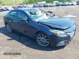 2018 Mazda 3 Touring z VIN 3MZBN1V38JM188734, wystawiony jako IAAI lot #42199683 z przebiegiem 70 184 mil mil oraz . Historia ofert i sprzedaży dostępna na DreamBid. Obrazek 1.