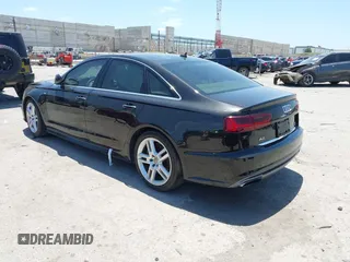 2016 Audi A6 Premium Plus with VIN WAUGFAFC0GN166596, listed as a IAAI auction lot 42526292 with 106,584 mi miles and . Bid and sale history available at DreamBid. Image 3.