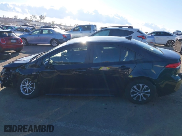 2021 Toyota Corolla Hybrid LE with VIN JTDEAMDE5MJ014959, listed as a IAAI auction lot 41751203 with 26,220 mi miles. Bid and sale history available at carsss.com. Image 14.