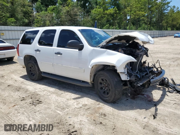 2014 Chevrolet Tahoe Commercial with VIN 1GNLC2E04ER202441, listed as a Copart auction lot 61310725 with 117,443 mi miles and Salvage title. Bid and sale history available at DreamBid. Image 4.