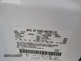 2007 Ford F-150 XLT with VIN 1FTRW14W47KC40614, listed as a Copart auction lot 42415565 with 295,398 mi miles and Salvage title. Bid and sale history available at DreamBid. Image 12.