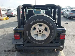 2003 Jeep Wrangler Sport with VIN 1J4FA49S23P328867, listed as a IAAI auction lot 41354414 with 96,703 mi miles. Bid and sale history available at carsss.com. Image 16.