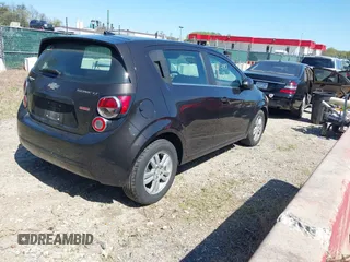 2014 Chevrolet Sonic LT with VIN 1G1JC6SB6E4210561, listed as a IAAI auction lot 42073197 with 100,945 mi miles. Bid and sale history available at carsss.com. Image 4.