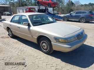 1997 Mercury Grand Marquis GS z VIN 2MELM74W6VX686321, wystawiony jako IAAI lot #41860061 z przebiegiem 159 487 mil mil oraz . Historia ofert i sprzedaży dostępna na DreamBid. Obrazek 1.