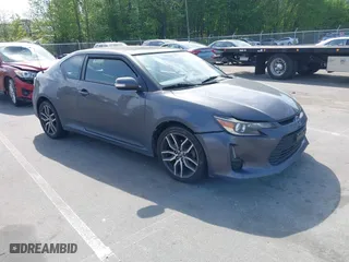 2015 Scion tC with VIN JTKJF5C71FJ013747, listed as a IAAI auction lot 42087740 with 138,097 mi miles. Bid and sale history available at carsss.com. Image 1.