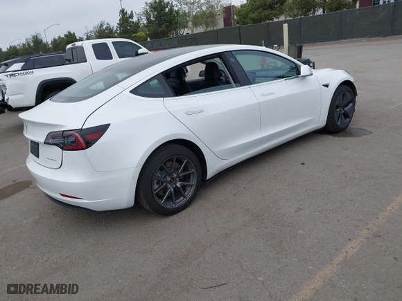 2019 Tesla Model 3 Long Range with VIN 5YJ3E1EB2KF361541, listed as a IAAI auction lot 41859373 with 54,664 mi miles. Bid and sale history available at carsss.com. Image 4.