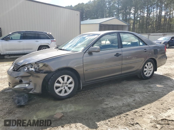 2003 Toyota Camry LE with VIN 4T1BE30K43U724778, listed as a Copart auction lot 53515605 with 176,568 mi miles and Salvage Title. Bid and sale history available at DreamBid. Image 1.