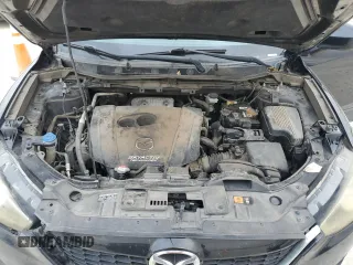 2015 Mazda CX-5 Touring with VIN JM3KE4CYXF0446370, listed as a Copart auction lot 52392575 with 132,419 mi miles and Salvage Title. Bid and sale history available at DreamBid. Image 12.