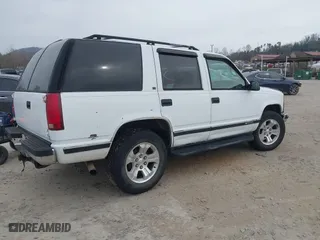1997 Chevrolet Tahoe with VIN 1GNEK13R4VJ361515, listed as a IAAI auction lot 41768386 with 216,974 mi miles. Bid and sale history available at carsss.com. Image 4.