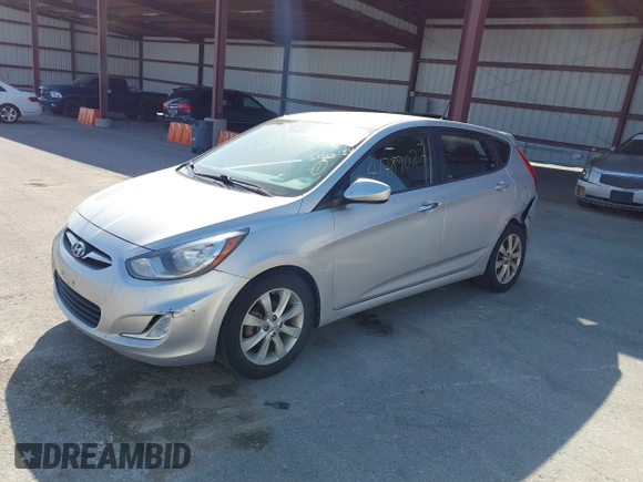2012 Hyundai Accent SE with VIN KMHCU5AE0CU021092, listed as a IAAI auction lot 41789027 with 137,557 mi miles. Bid and sale history available at carsss.com. Image 2.
