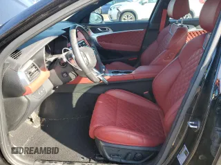 2023 Genesis G70 3.3T with VIN KMTG54TE4PU122153, listed as a Copart auction lot 50794015 with 13,604 mi miles and Salvage title. Bid and sale history available at DreamBid. Image 7.