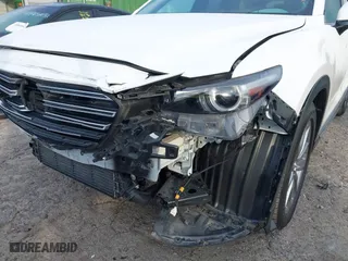 2016 Mazda CX-9 Grand Touring with VIN JM3TCBDY3G0116309, listed as a IAAI auction lot 40890199 with 64,948 mi miles. Bid and sale history available at carsss.com. Image 6.