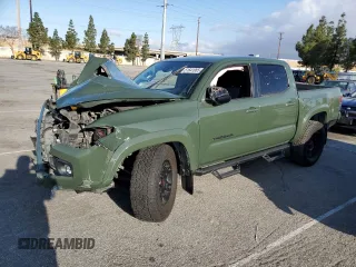 2021 Toyota Tacoma SR5 z VIN 3TMAZ5CN6MM157145, wystawiony jako Copart lot #51641085 z przebiegiem Nie podano mil oraz Szkoda całkowita • Salvage title. Historia ofert i sprzedaży dostępna na DreamBid. Obrazek 1.