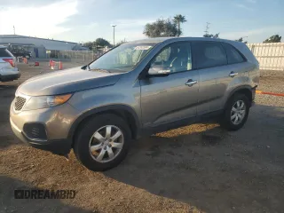 2012 Kia Sorento LX with VIN 5XYKTCA62CG255185, listed as a Copart auction lot 87242304 with 124,224 mi miles and Salvage Title. Bid and sale history available at DreamBid. Image 1.