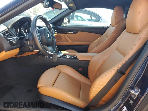 2011 BMW Z4 sDrive35is with VIN WBALM1C56BE393858, listed as a Copart auction lot 74249954 with Not provided miles and Salvage title. Bid and sale history available at DreamBid. Image 7.
