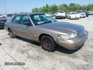 2002 Mercury Grand Marquis GS z VIN 2MEFM74W82X630017, wystawiony jako IAAI lot #42016061 z przebiegiem 135 637 mil mil oraz . Historia ofert i sprzedaży dostępna na DreamBid. Obrazek 1.