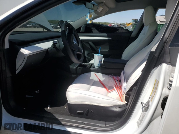 2023 Tesla Model 3 with VIN 5YJ3E1EA3PF602067, listed as a Copart auction lot 52317695 with 54,867 mi miles and Salvage Title. Bid and sale history available at DreamBid. Image 7.