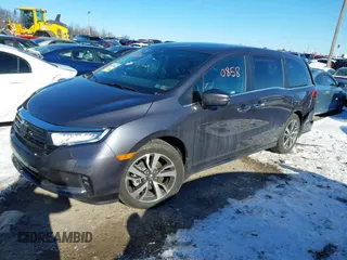 2023 Honda Odyssey Touring with VIN 5FNRL6H80PB005769, listed as a IAAI auction lot 41280858 with 7,041 mi miles and . Bid and sale history available at DreamBid. Image 2.