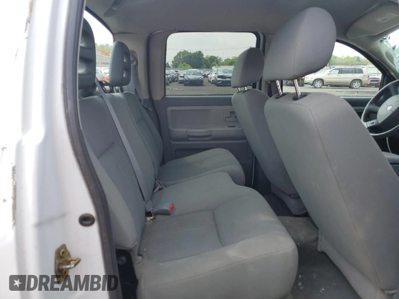 2006 Dodge Dakota SLT z VIN 1D7HW48N76S671886, wystawiony jako Copart lot #59487655 z przebiegiem Nie podano mil oraz Szkoda całkowita • Salvage title. Historia ofert i sprzedaży dostępna na DreamBid. Obrazek 10.