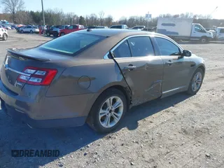 2015 Ford Taurus SEL with VIN 1FAHP2E83FG206055, listed as a IAAI auction lot 41943670 with 90,808 mi miles and . Bid and sale history available at carsss.com. Image 4.