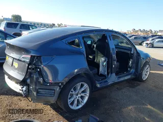 2021 Tesla Model Y Long Range with VIN 5YJYGDEE5MF191142, listed as a IAAI auction lot 41448514 with 71,626 mi miles. Bid and sale history available at carsss.com. Image 6.