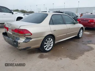 2001 Honda Accord EX z VIN 1HGCG165X1A077702, wystawiony jako IAAI lot #41770556 z przebiegiem 149 516 mil mil oraz . Historia ofert i sprzedaży dostępna na DreamBid. Obrazek 4.