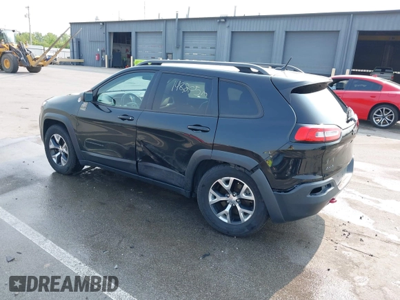 2015 Jeep Cherokee Trailhawk with VIN 1C4PJMBS6FW786622, listed as a IAAI auction lot 42403215 with 148,205 mi miles and . Bid and sale history available at DreamBid. Image 3.