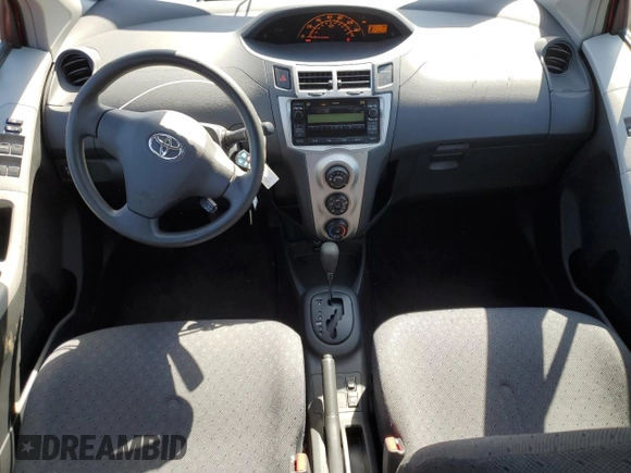 2009 Toyota Yaris with VIN JTDKT903095246576, listed as a Copart auction lot 52150915 with 90,276 mi miles and Salvage Title. Bid and sale history available at DreamBid. Image 8.