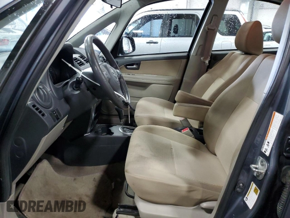 2009 Suzuki SX4 Man FWD with VIN JS2YC412496200218, listed as a Copart auction lot 46938825 with 63,909 mi miles and Salvage Title. Bid and sale history available at carsss.com. Image 7.