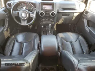 2015 Jeep Wrangler Unlimited Sahara with VIN 1C4HJWEGXFL744852, listed as a Copart auction lot 60246145 with 135,496 mi miles and Salvage title. Bid and sale history available at DreamBid. Image 8.